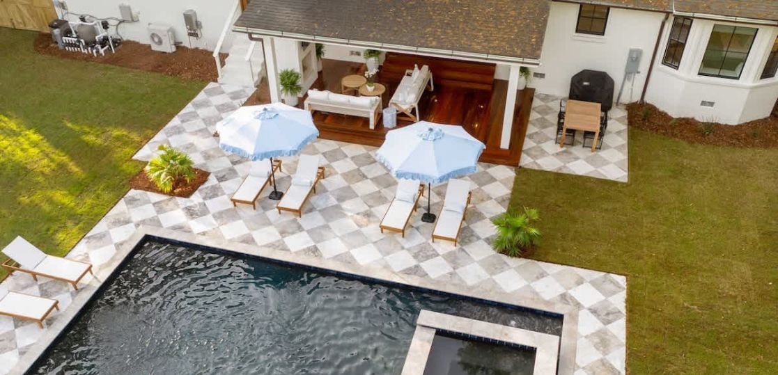 Luxury vacation rental property with outdoor swimming pool and patio